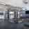 Fitness center with garage doors open and view of pool