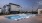 twilight pool with view of townhomes for rent