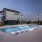 twilight pool with view of townhomes for rent