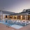 twilight pool with view of clubhouse