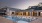 twilight pool with view of clubhouse