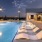 twilight pool with lounge chairs