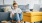 a girl sitting on the floor by a couch