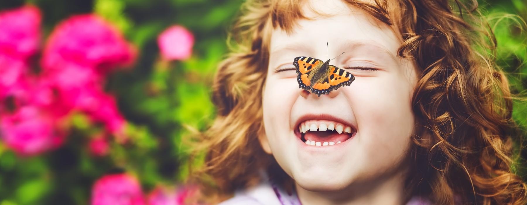 a child with a butterfly on their face